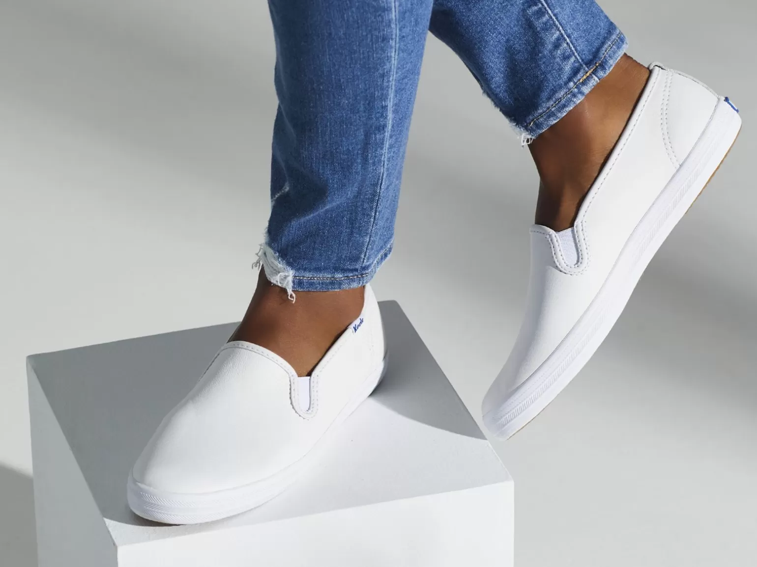 Keds Leather>Women's Champion Leather Slip On Sneaker White